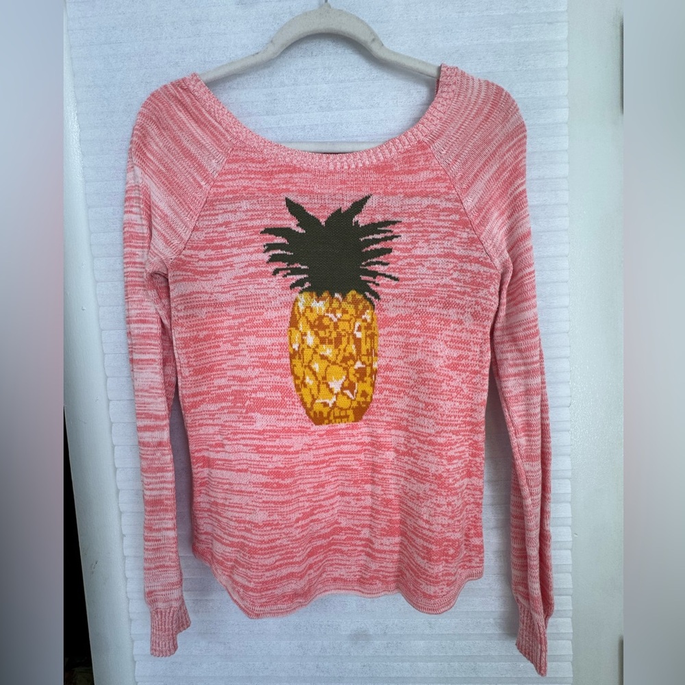 Pink Sweater with Pineapple Design and open back.
